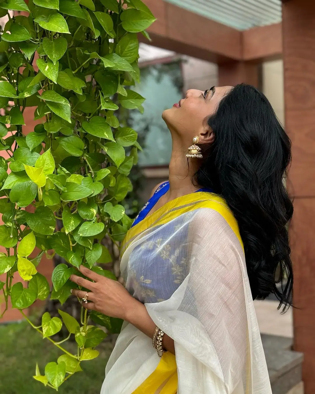 Aishwarya Lekshmi Wearing White Saree Blue Sleeveless Blouse